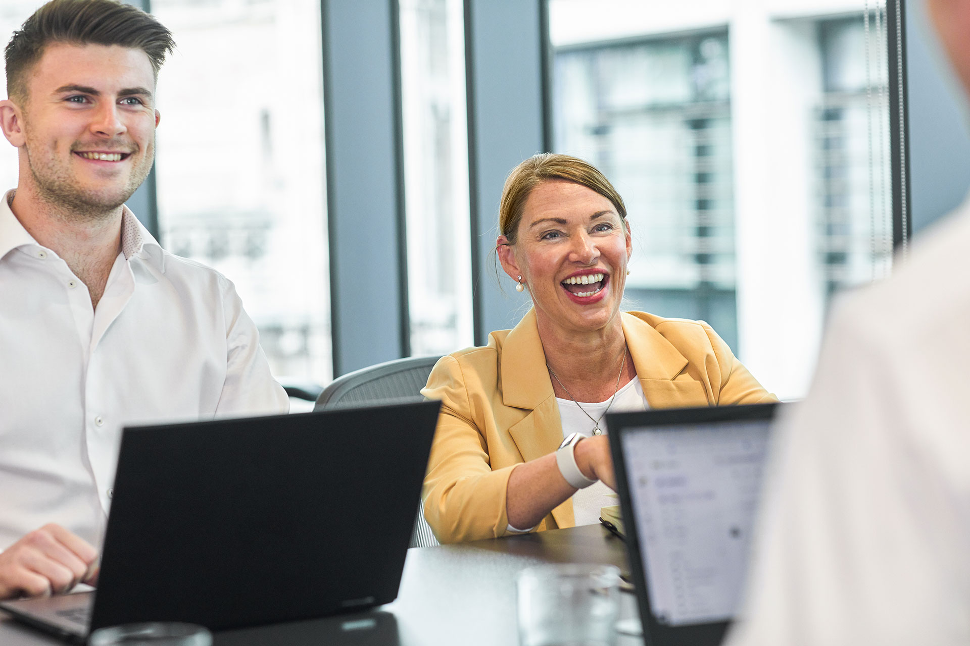 woman-laughing-in-meeting